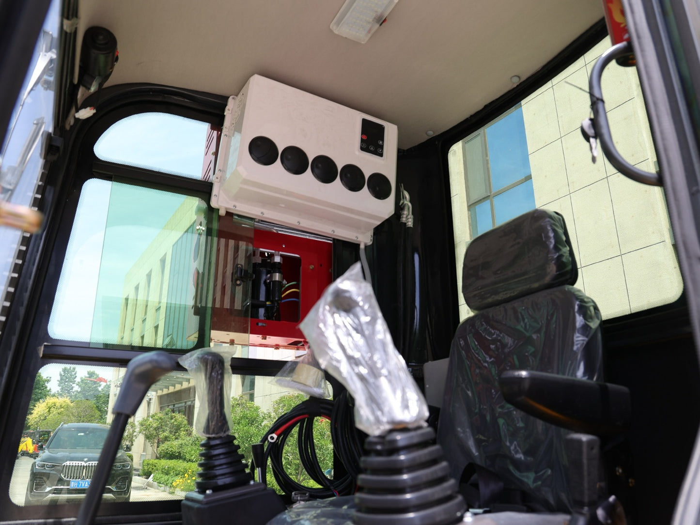 Close-up of 2 Ton Closed Cab Excavator with Kubota Diesel Engine AC and In Cab Heater - Excavator for Sale In BC - tough and durable heavy equipment.